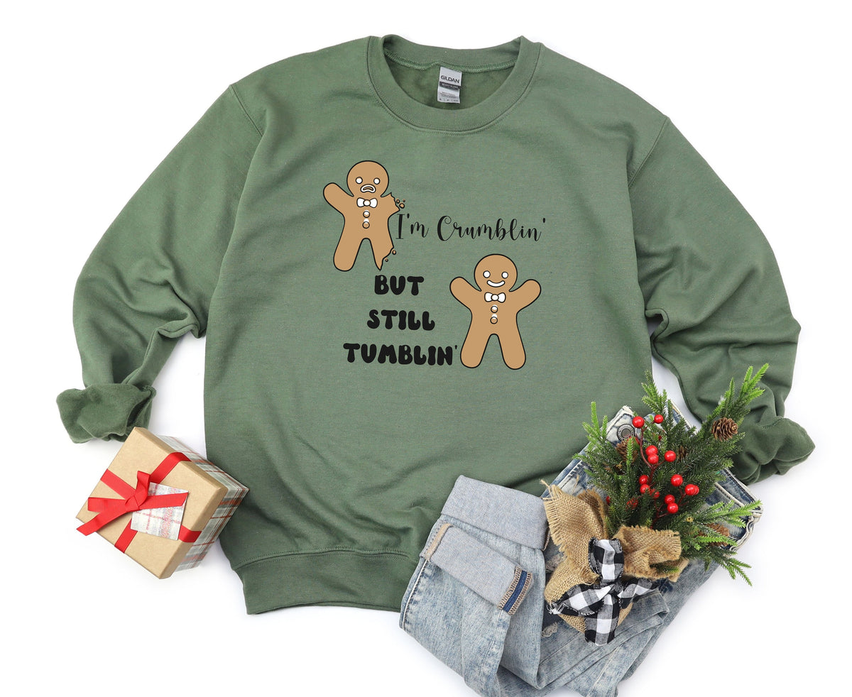 Funny Gingerbread Man Sweatshirt in military green flat lay with gift box, jeans and greenery.