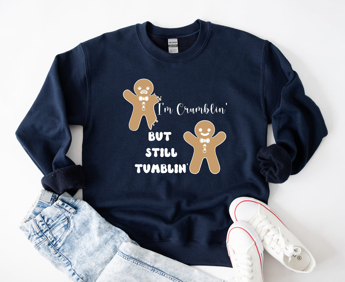 Funny Gingerbread Man Sweatshirt in navy, flat-lay with jeans and white sneakers beside two cartoon gingerbread figures.