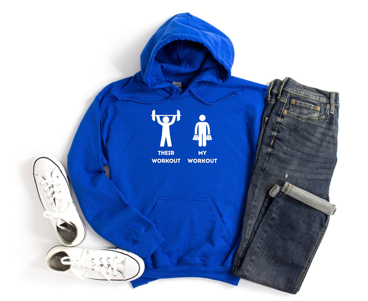 Funny Workout Hoodie royal laid flat from above beside white sneakers and jeans on white.