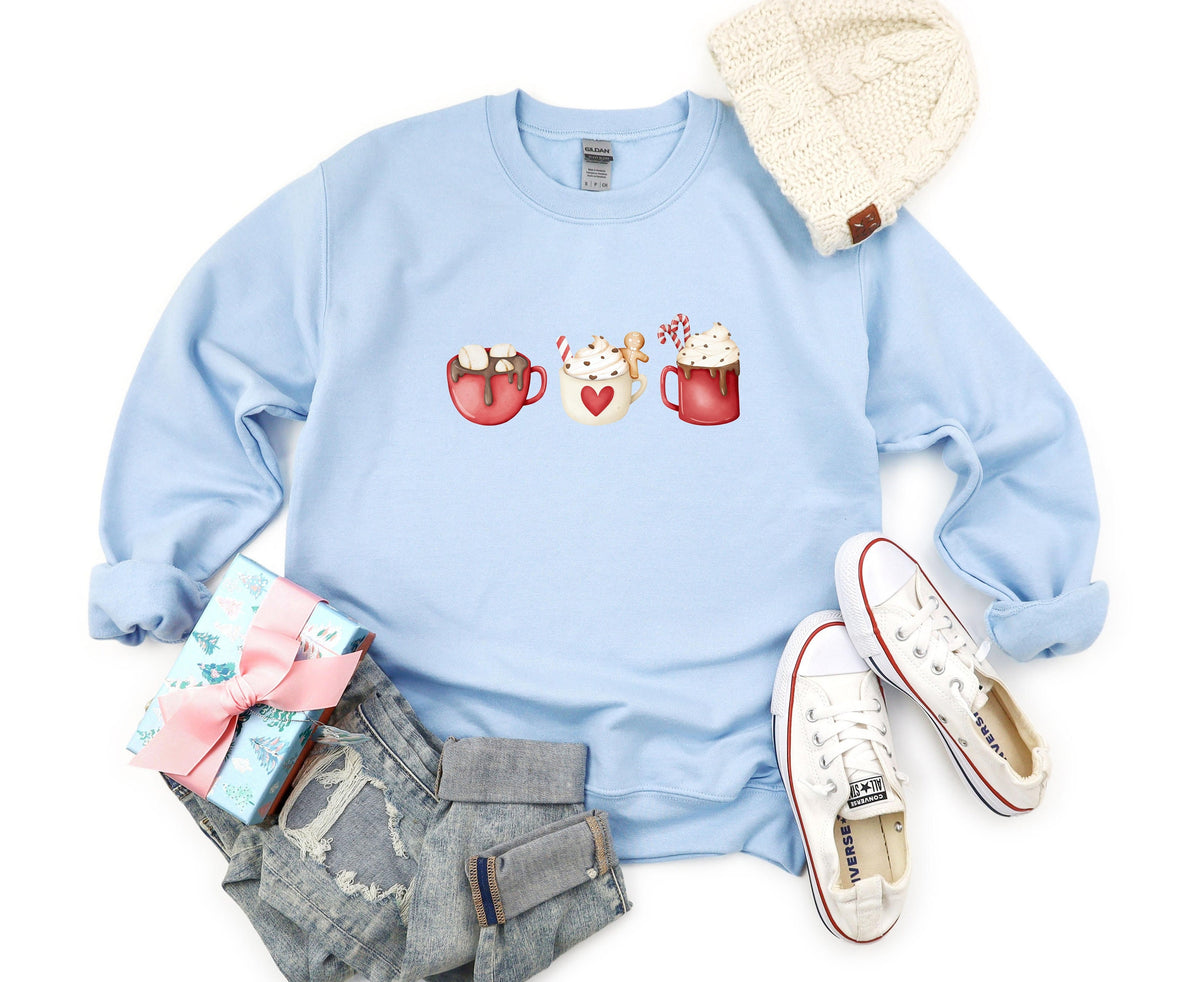 Coffee Cocoa and Gingerbread Cookies Sweatshirt light blue flat lay with beanie, gift, jeans and sneakers.