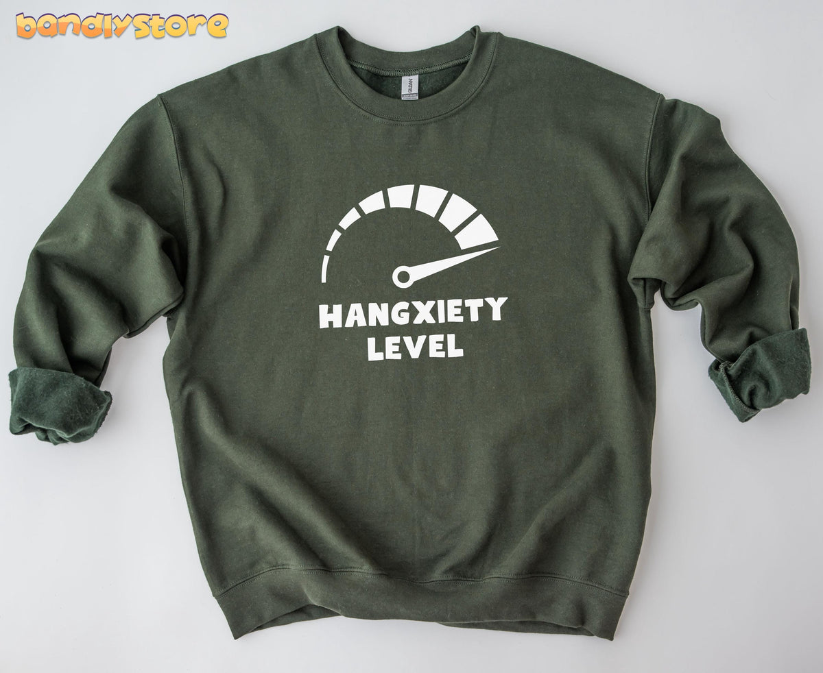 Hangxiety Hangover Sweatshirt in military green lies flat on a plain white surface, front view, sleeves rolled.