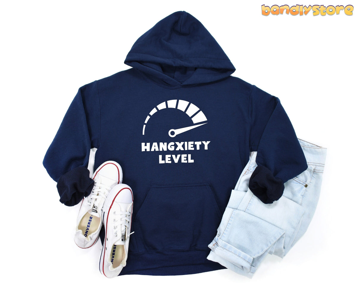 Hangxiety Hangover Hoodie navy flat-lay with white sneakers and jeans on white background.