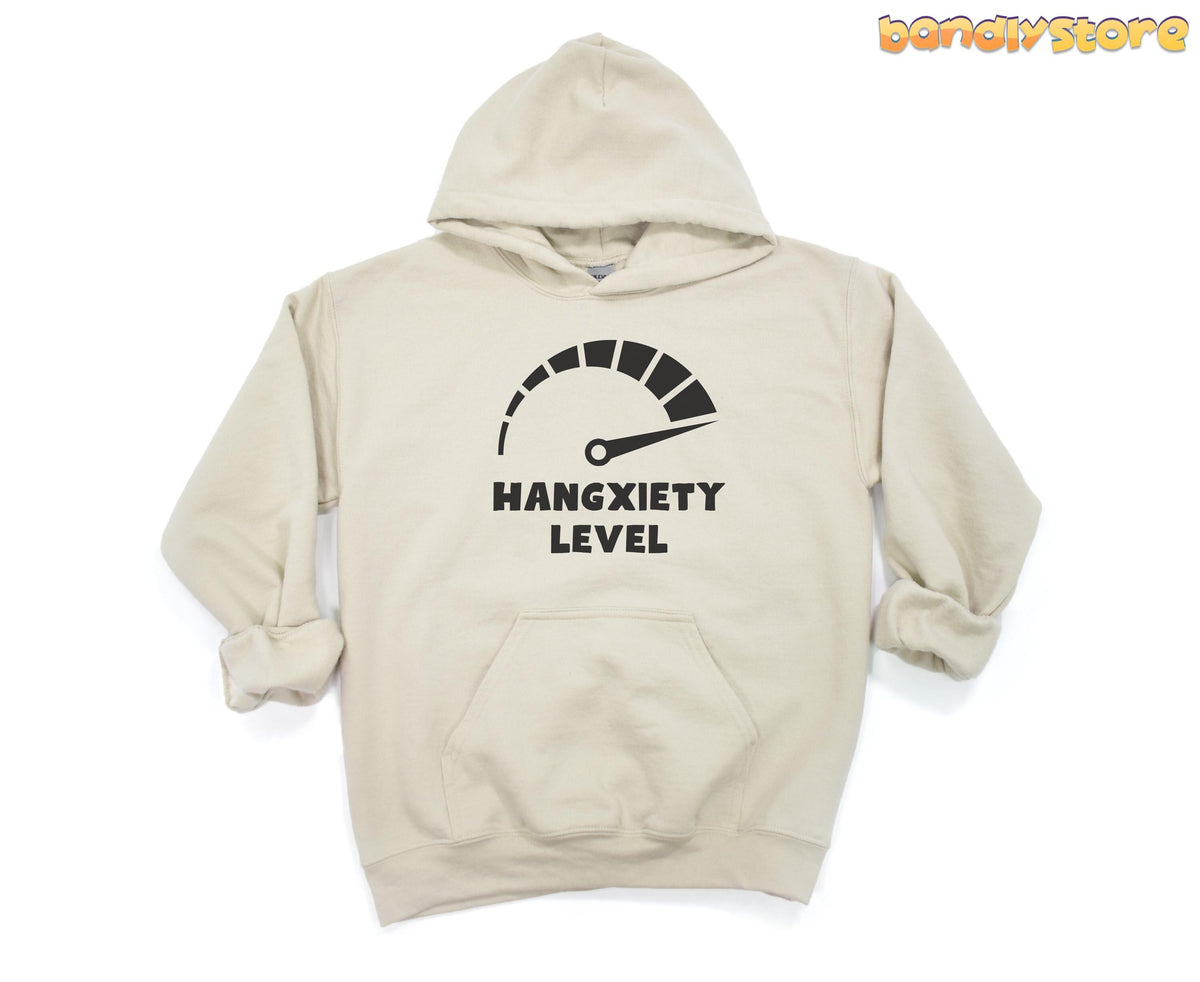 Hangxiety Hangover Hoodie in sand, flat lay front view with gauge graphic pointing high and empty white background.