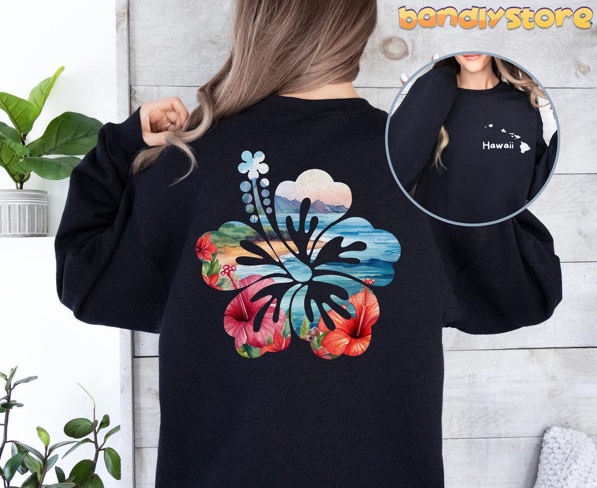 Hawaii Hibiscus Sweatshirt with Back Print on a black sweatshirt, rear view with beach scene and plants nearby.