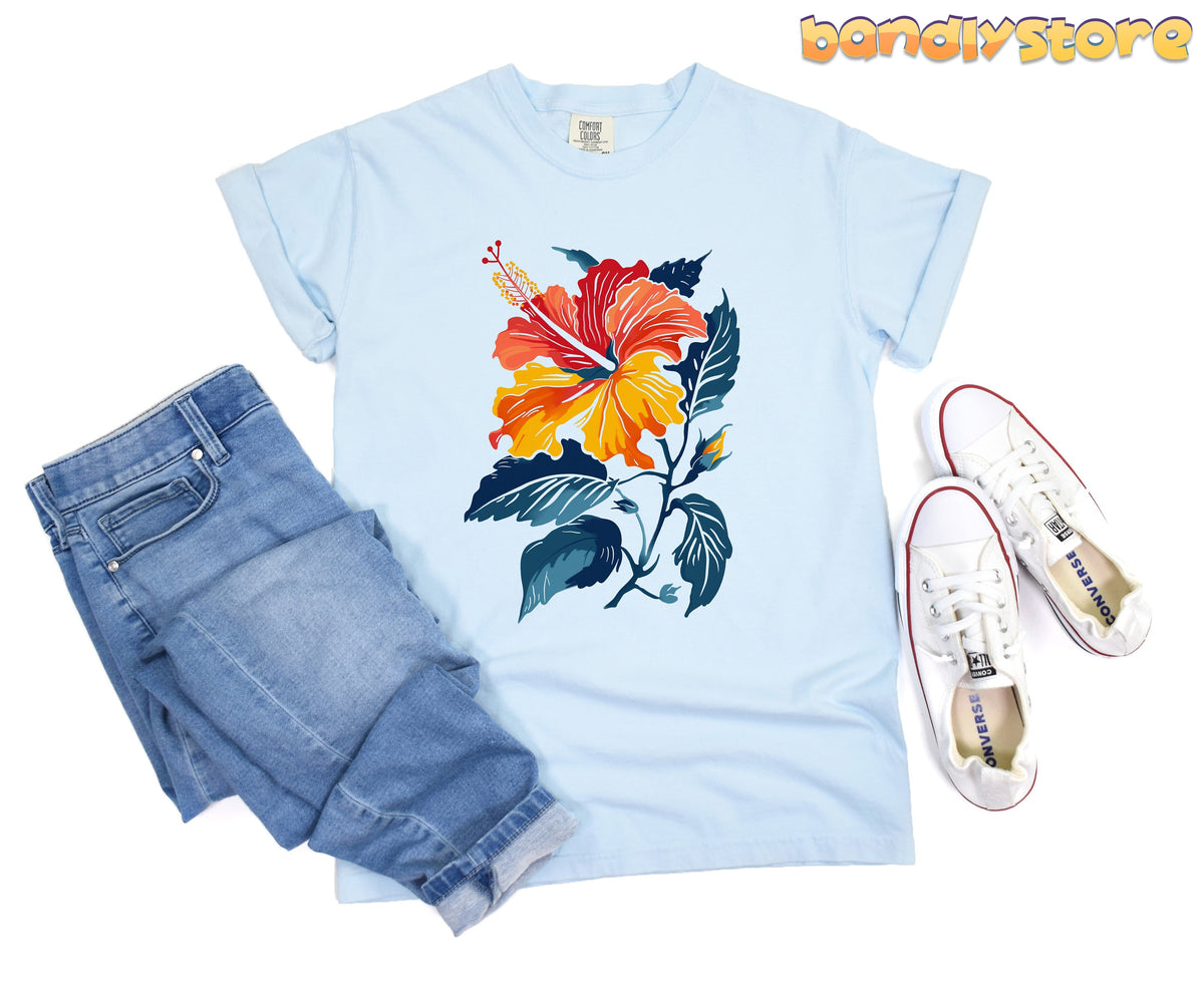 Hibiscus Flower T-Shirt in chambray laid flat from above beside folded jeans and sneakers.