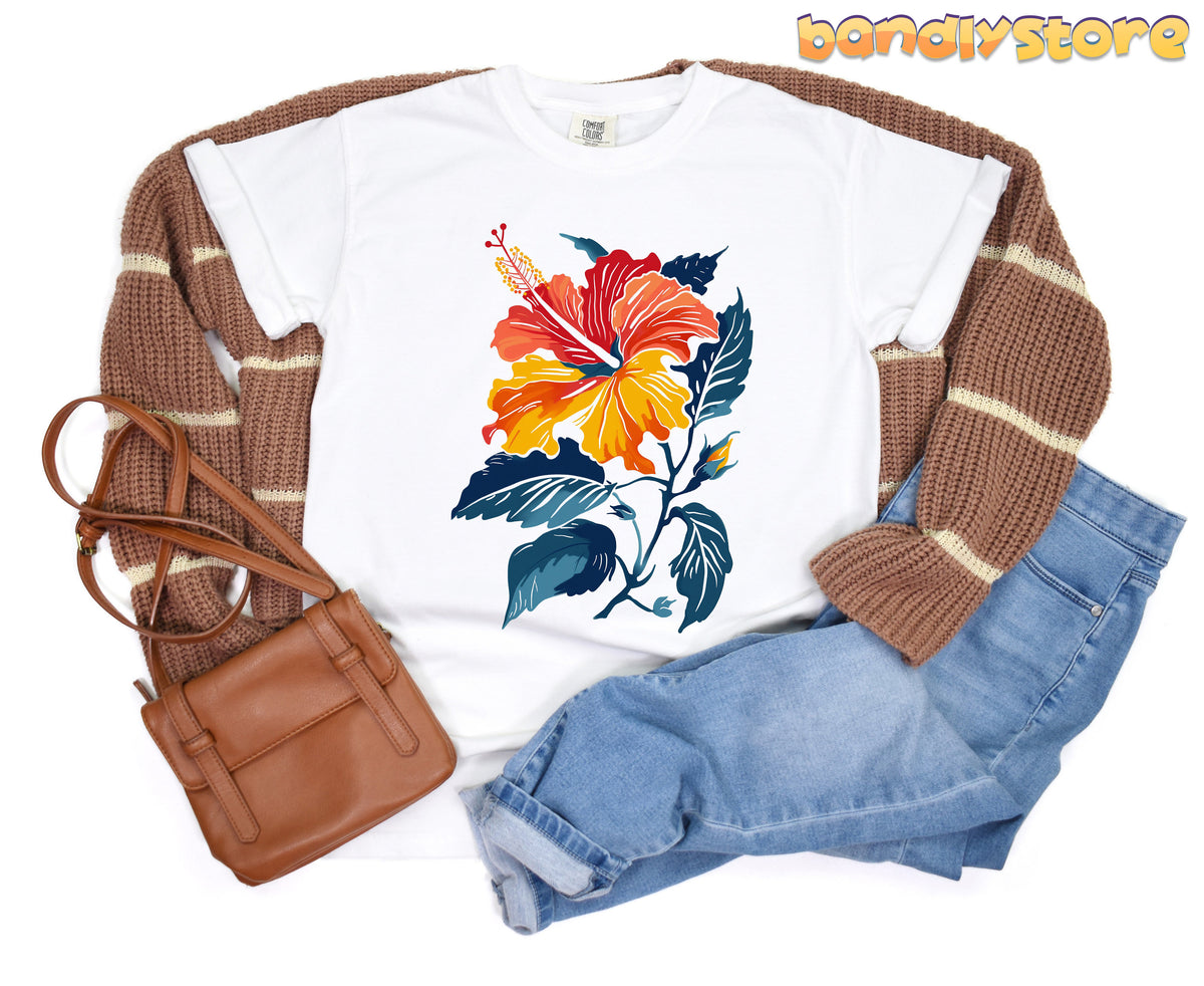 Hibiscus Flower T-Shirt in white laid flat with brown cardigan, blue jeans and brown bag.