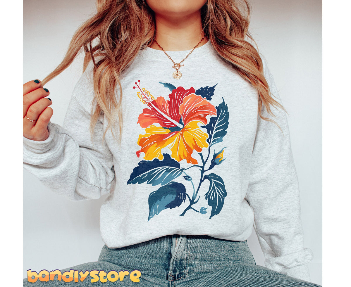 Hibiscus Flower Sweatshirt in ash on a person from torso to hips against a plain background, hand in hair.