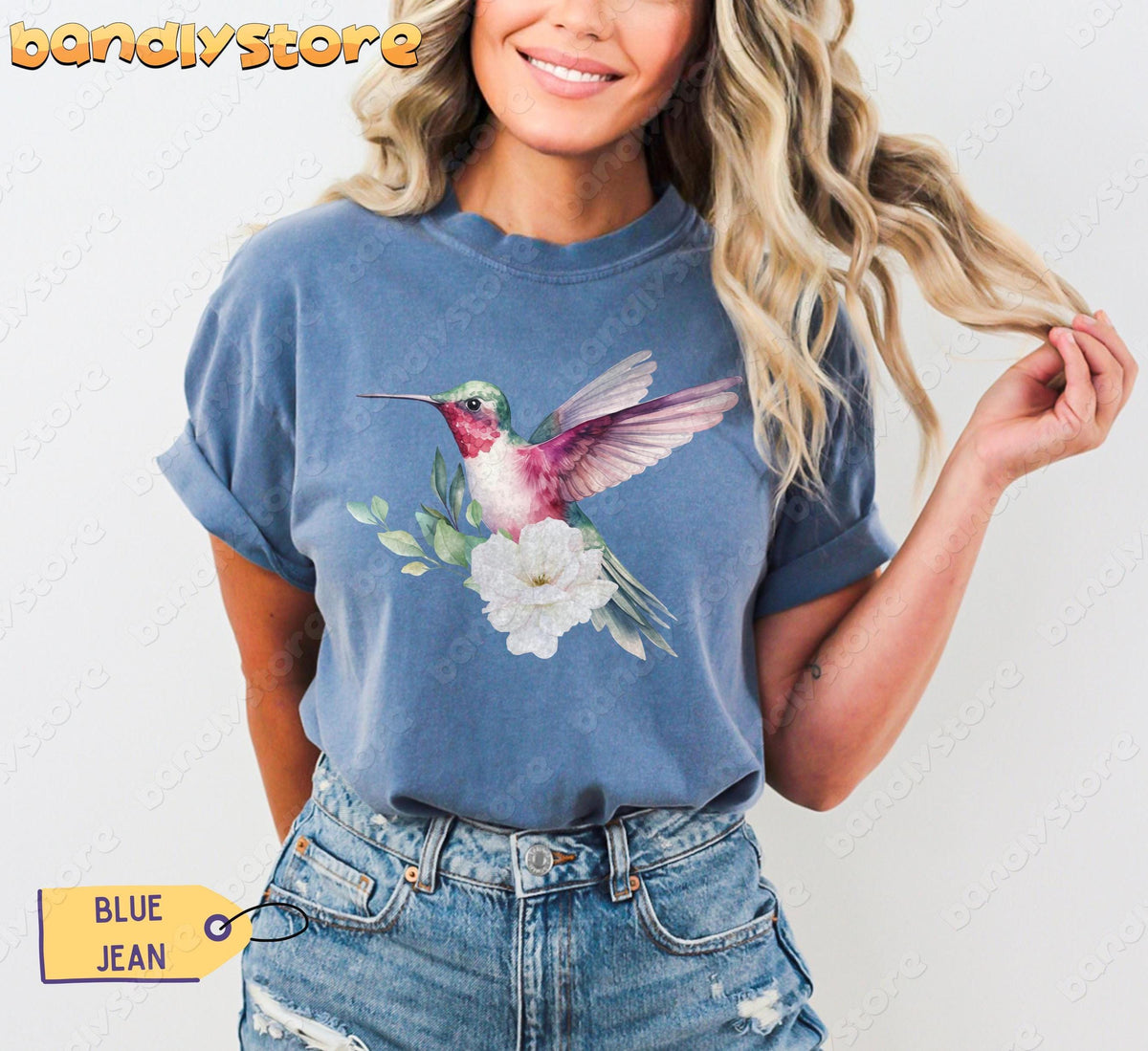 Hummingbird Flower T-Shirt in Blue Jean on a smiling woman holding her blonde hair, front view with jeans.