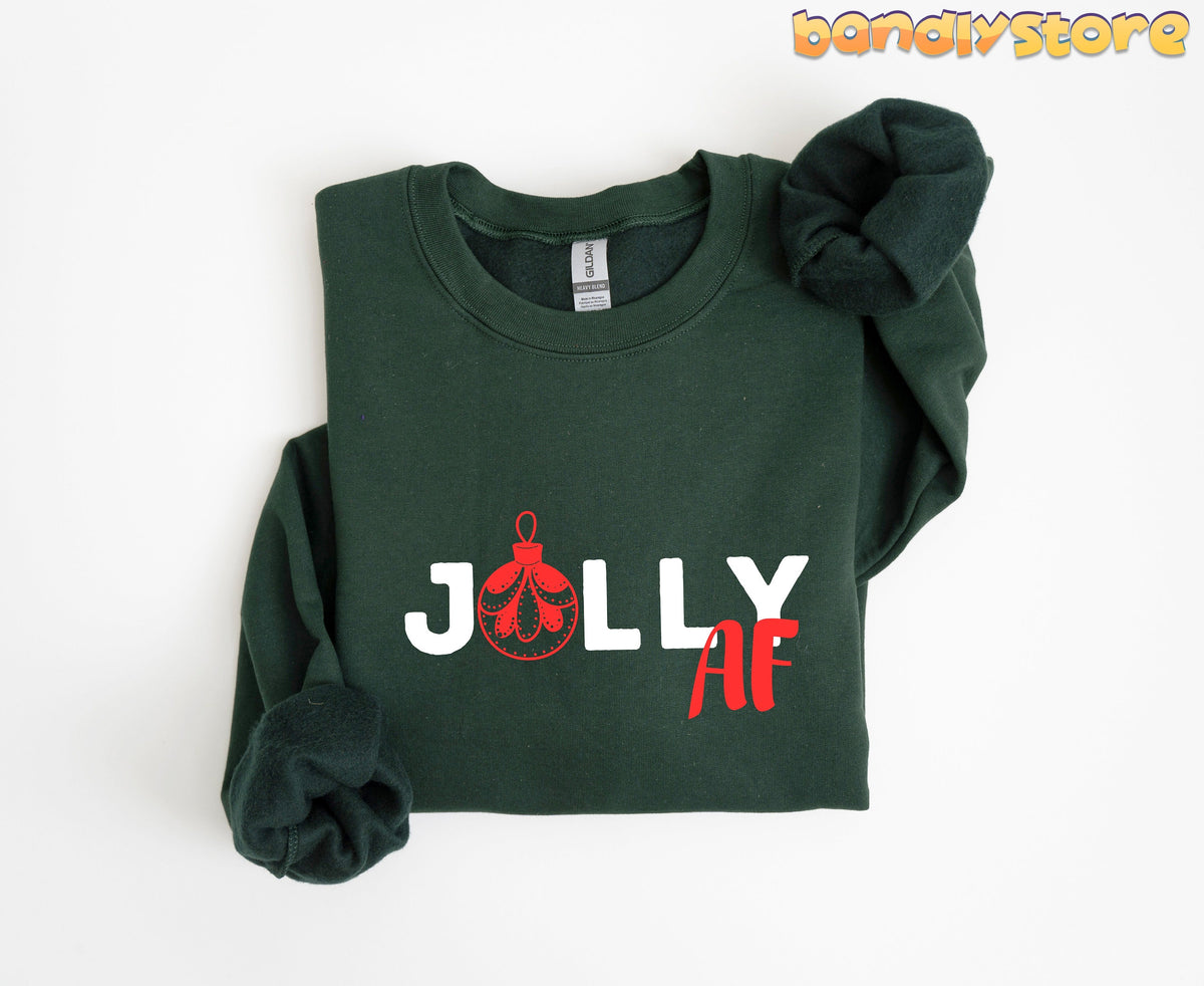 Jolly AF Christmas Sweatshirt in forest green folded flat on a plain white background.