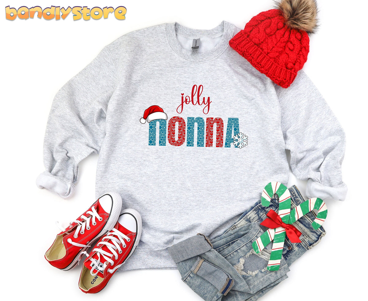 Jolly Nonna Sweatshirt in ash, flat-lay with red beanie, sneakers, jeans and candy canes.