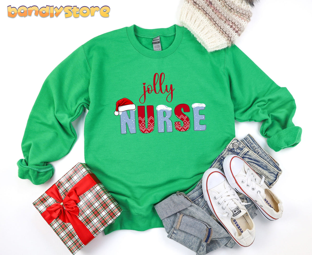Jolly Nurse Sweatshirt in Irish Green laid flat with knit beanie, gift box, jeans and sneakers.