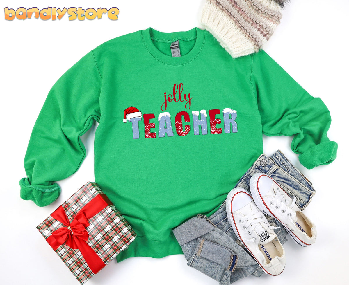 Jolly Teacher Sweatshirt in Irish Green flat-laid with gift, jeans, sneakers and knit hat.