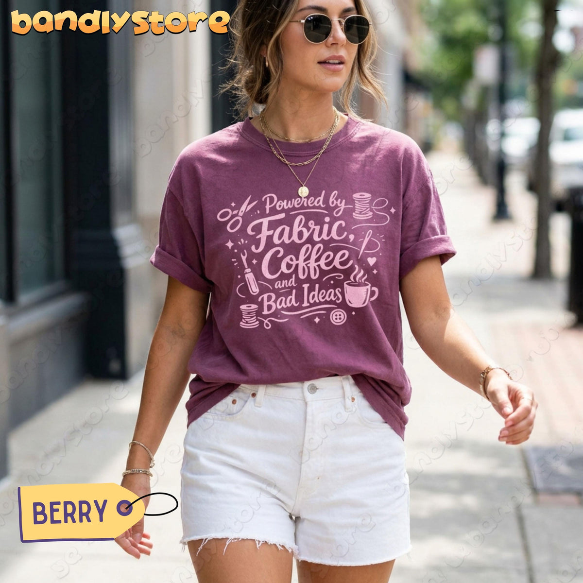 Linocut Sewing T-Shirt in Berry on a woman walking a city sidewalk, front view.