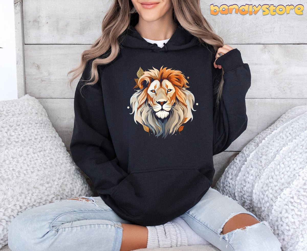 Majestic Lion Hoodie in black worn by a seated person against a wooden wall with white pillows.