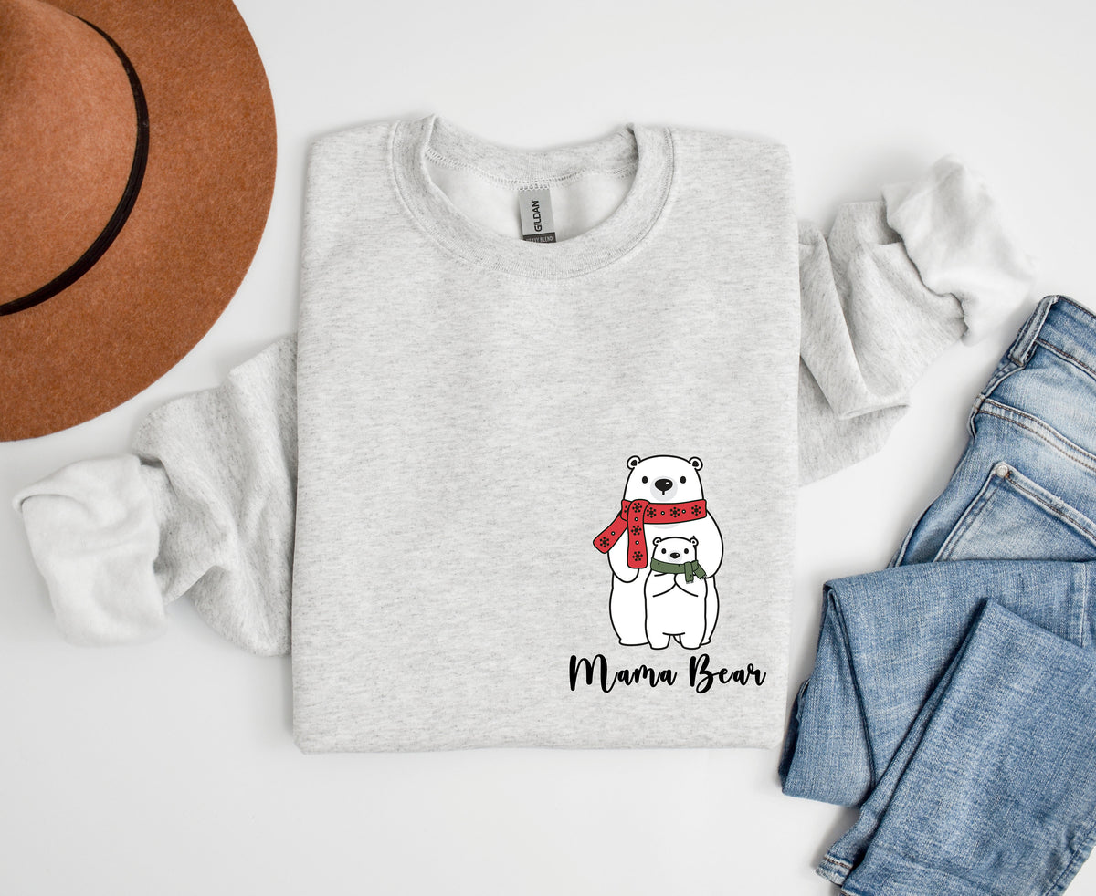 Pocket Mama Bear Sweatshirt in ash laid flat overhead beside a brown hat and blue jeans.
