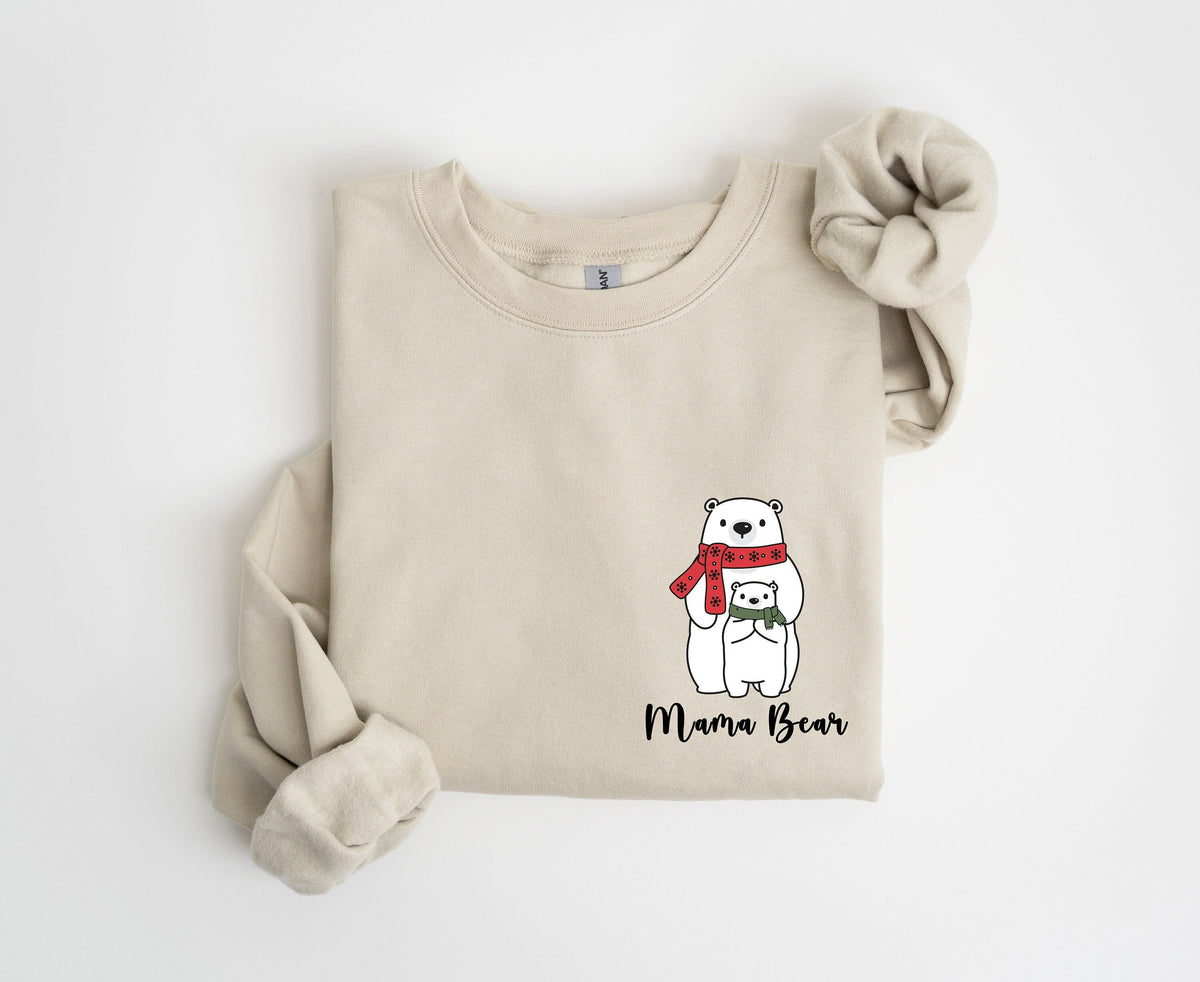 Pocket Mama Bear Sweatshirt in sand folded flat on a plain white background.