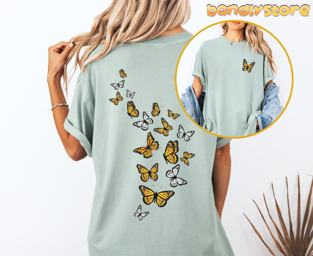 Monarch Butterfly T-Shirt with Back Print in Bay, back view on model with front inset and palm fronds.