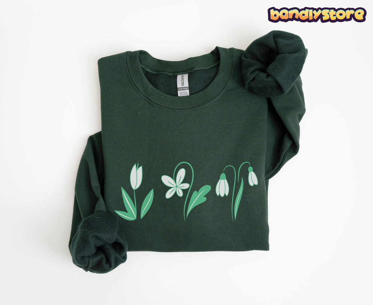 Monochrome Spring Flowers Sweatshirt in forest green folded flat on a plain white background.
