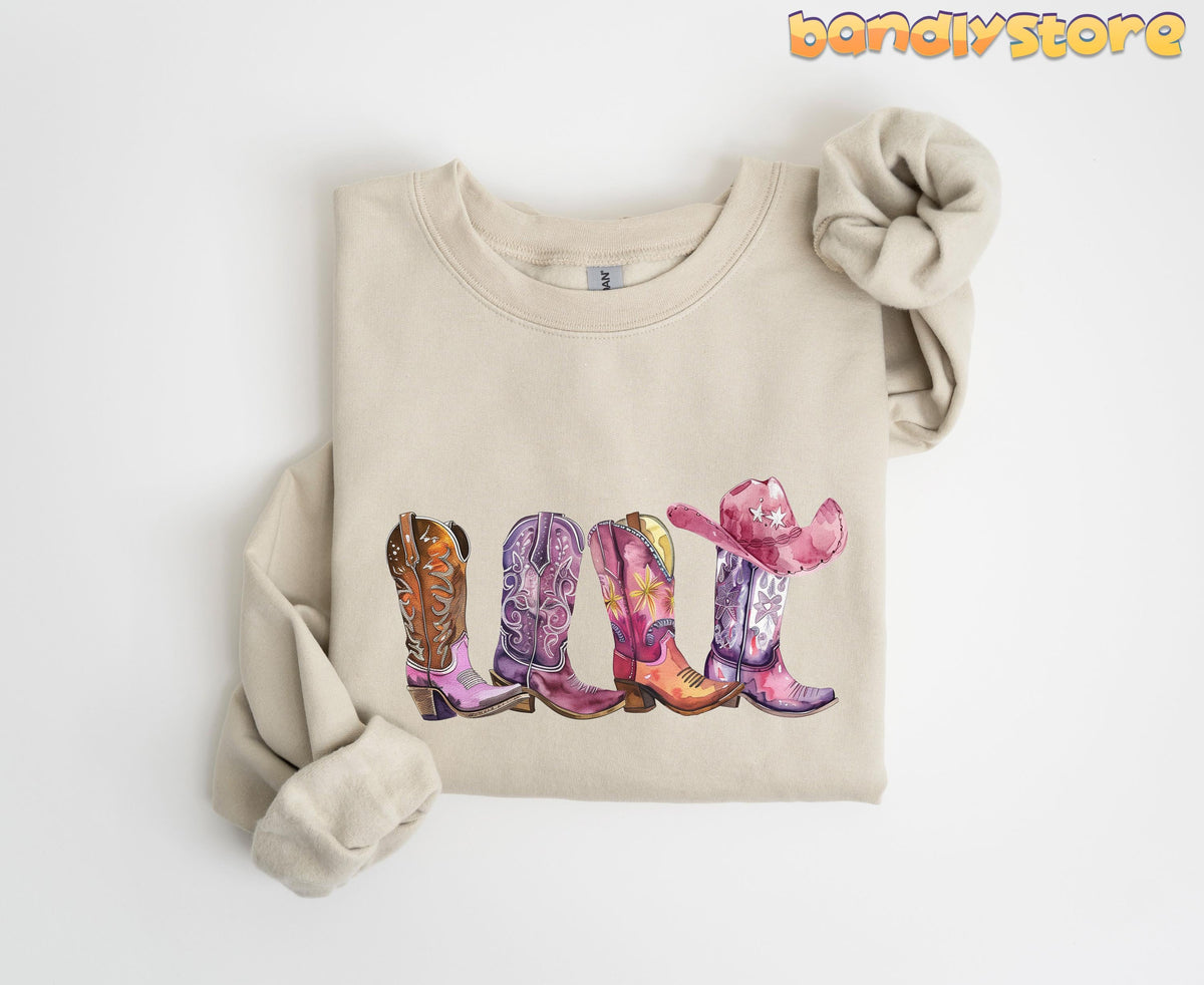 Pink Cowgirl Boots Sweatshirt in sand folded on white background in top-down view.