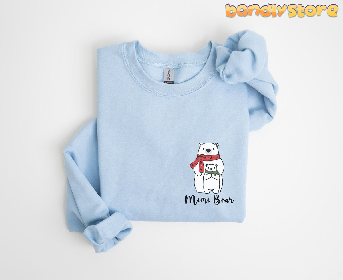 Pocket Mimi Bear Sweatshirt in light blue folded flat on a plain white background.