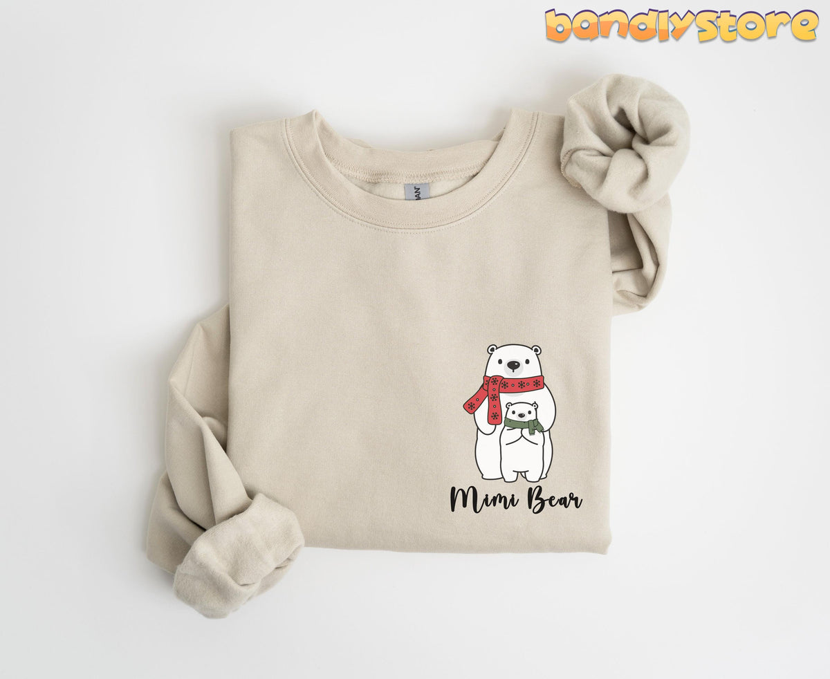 Pocket Mimi Bear Sweatshirt in Sand folded flat on a plain white background from above.
