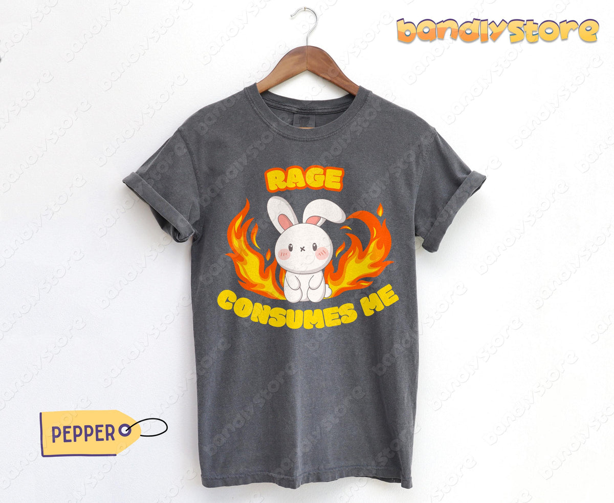Rage Consumes Me T-Shirt in pepper hanging on a wooden hanger against a white wall next to a PEPPERO tag.