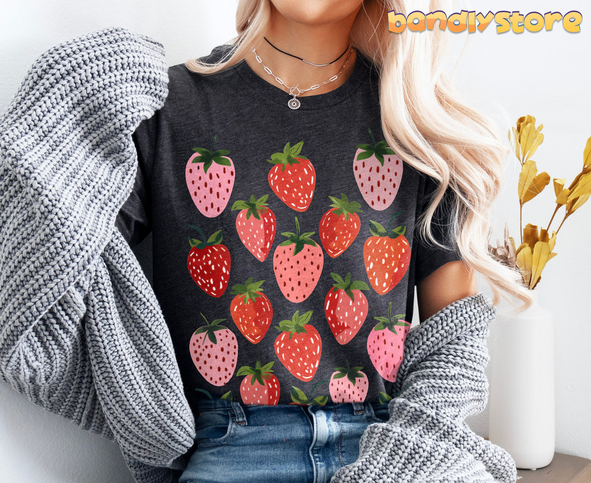 Retro Strawberry T-Shirt in dark grey heather front view with sweater draped and vase nearby.