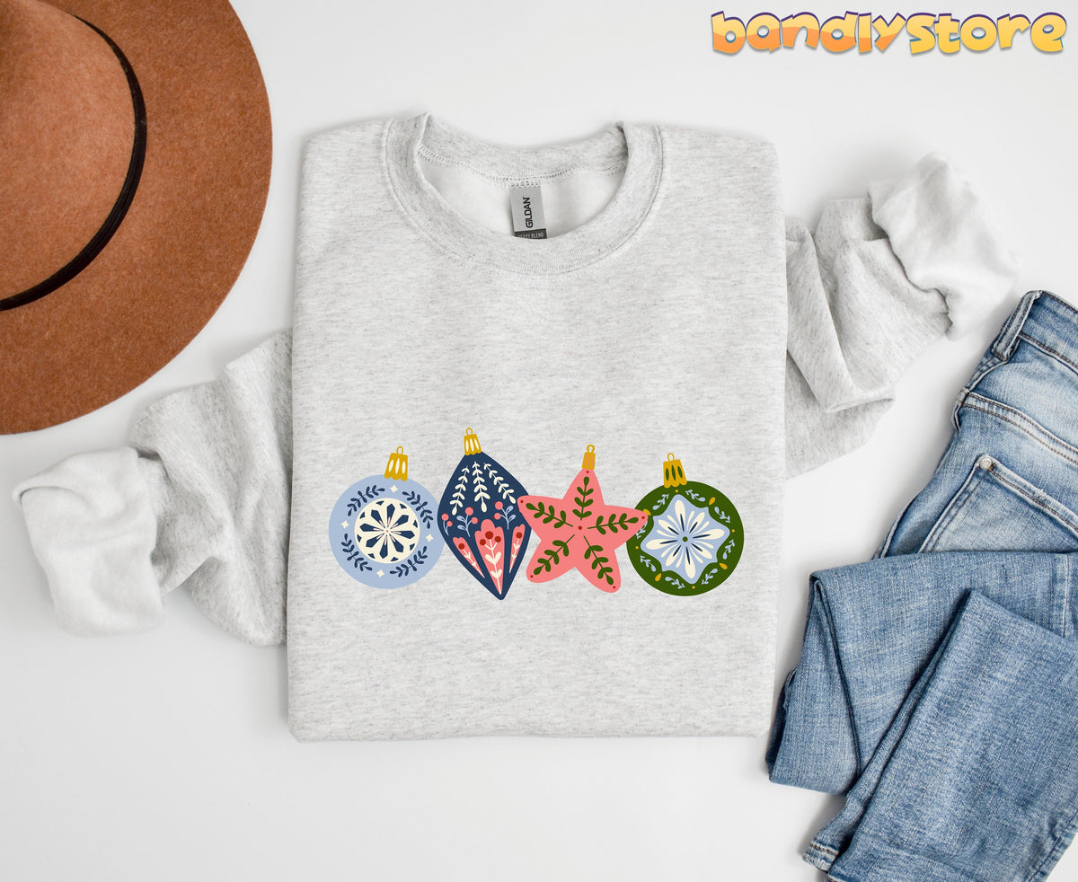 Scandinavian Christmas Sweatshirt in ash, top-down flat lay beside a brown hat and blue jeans.