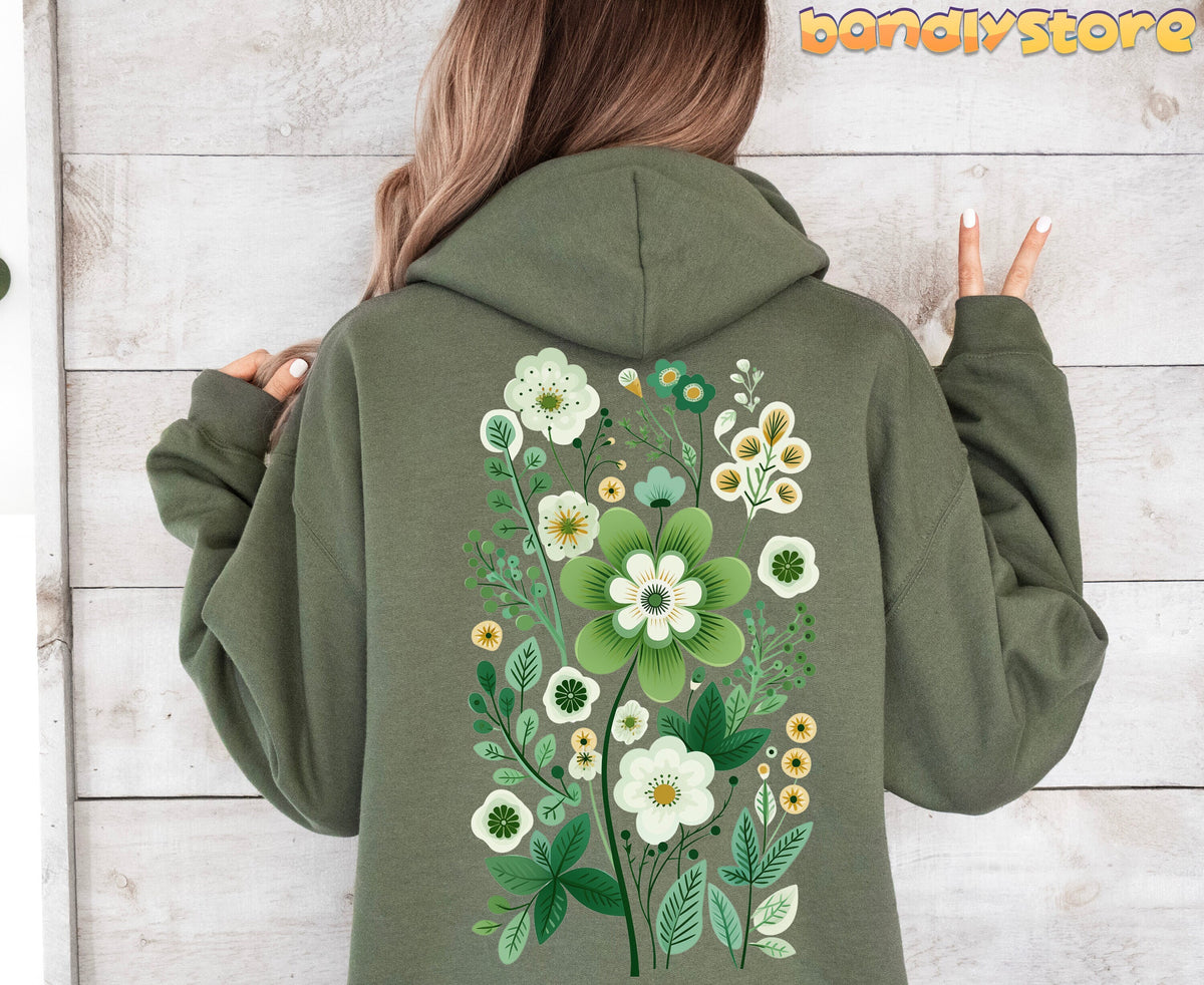 Scandinavian Wildflowers Hoodie in military green, back view on a person against light wooden panels.