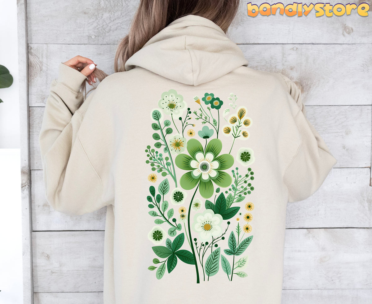 Scandinavian Wildflowers Hoodie in sand, back view on person against light wood wall.