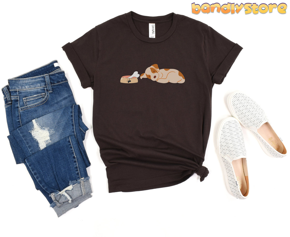 Sleeping Dog T-Shirt in brown flat-laid beside jeans and slip-on shoes.