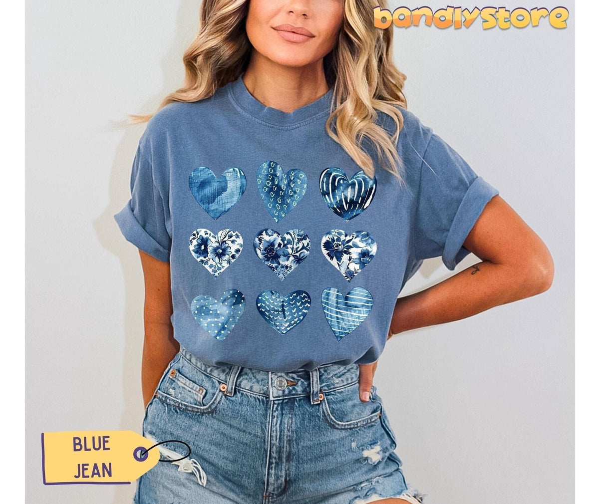 Toile De Jouy Hearts T-Shirt in Blue Jean on a woman standing front-facing against a plain wall.