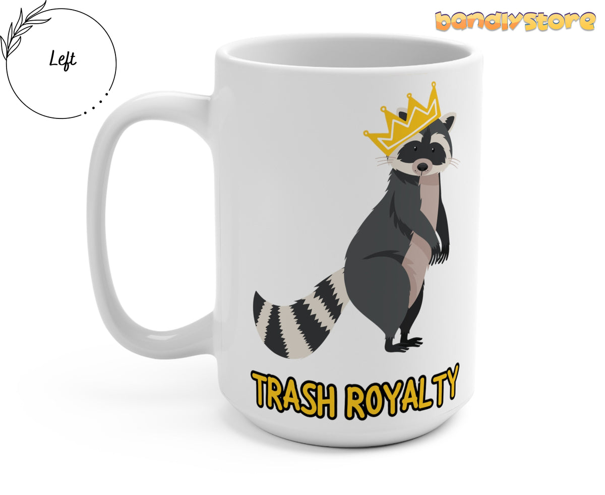 Trash Royalty Raccoon Mug on a white mug, left-side handle view, crowned raccoon and yellow TRASH ROYALTY text.