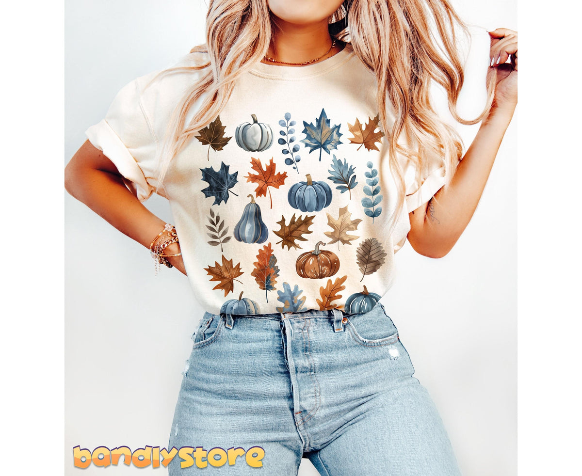 Vintage Fall Leaves T-Shirt in ivory on a woman posing front-on against a plain white background.